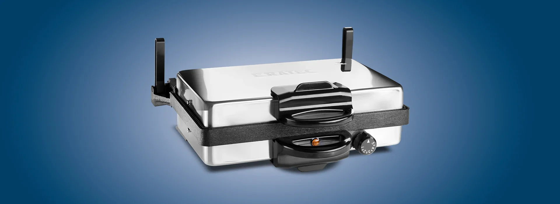 Silver waffle iron with temperature control on a blue background